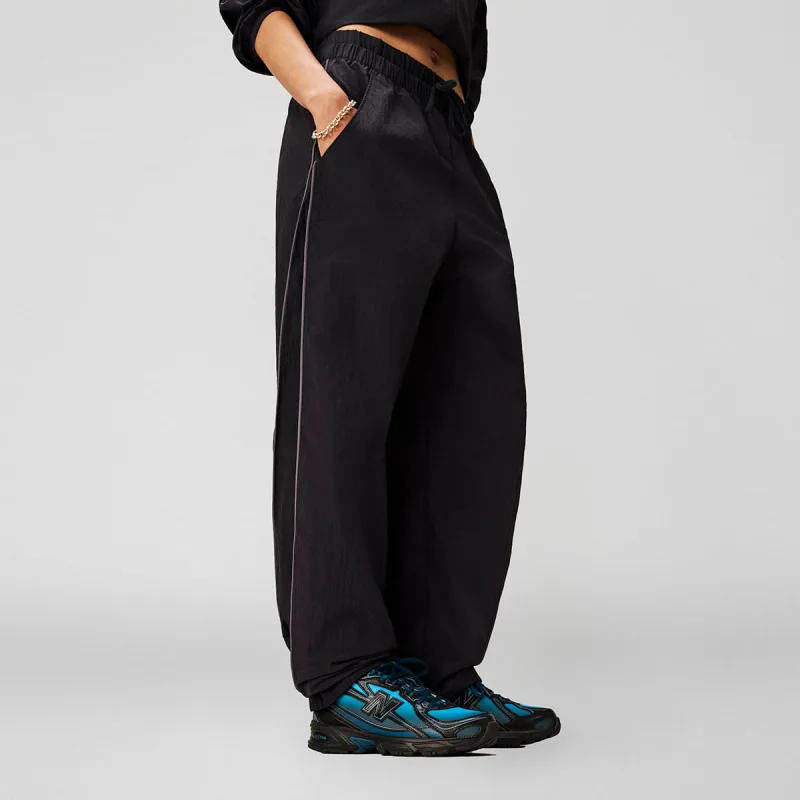 Calça Sport Legacy Woven Feminina - New Balance