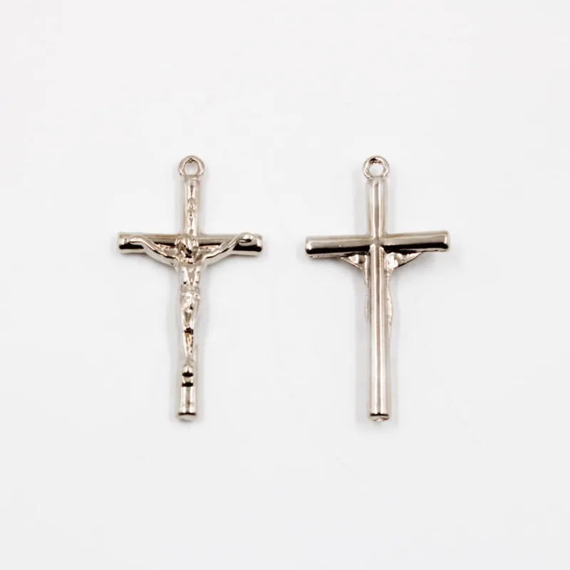 PINGENTE CRUZ SIMPLES COM CRISTO 40X20MM EM ZAMAC COM 100GR Niquel