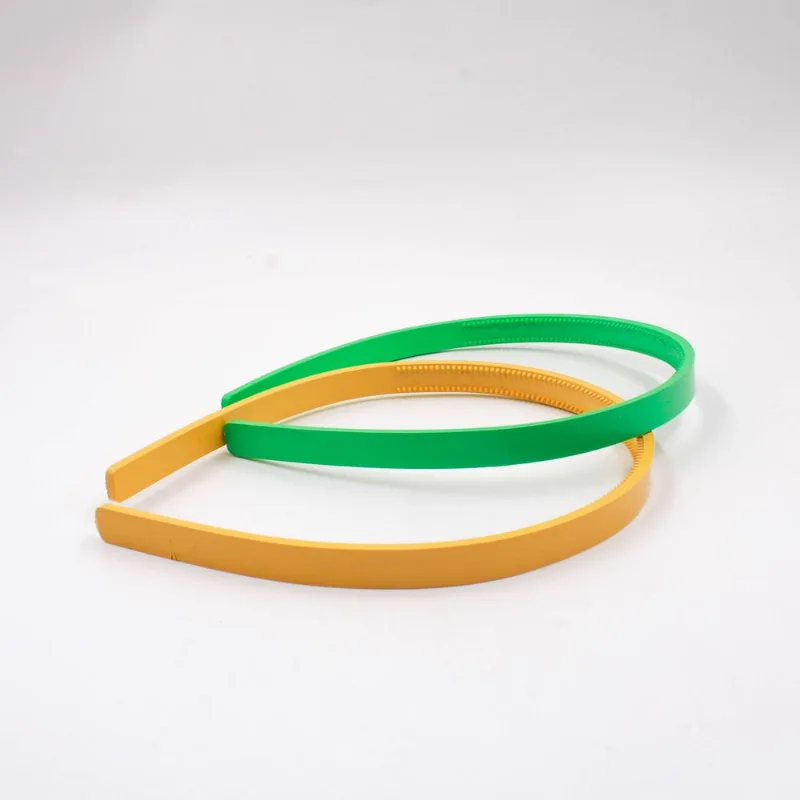 TIARA COM DENTE 10MM EM PLÁSTICO COM 12 UNIDADES Verde E Amarelo