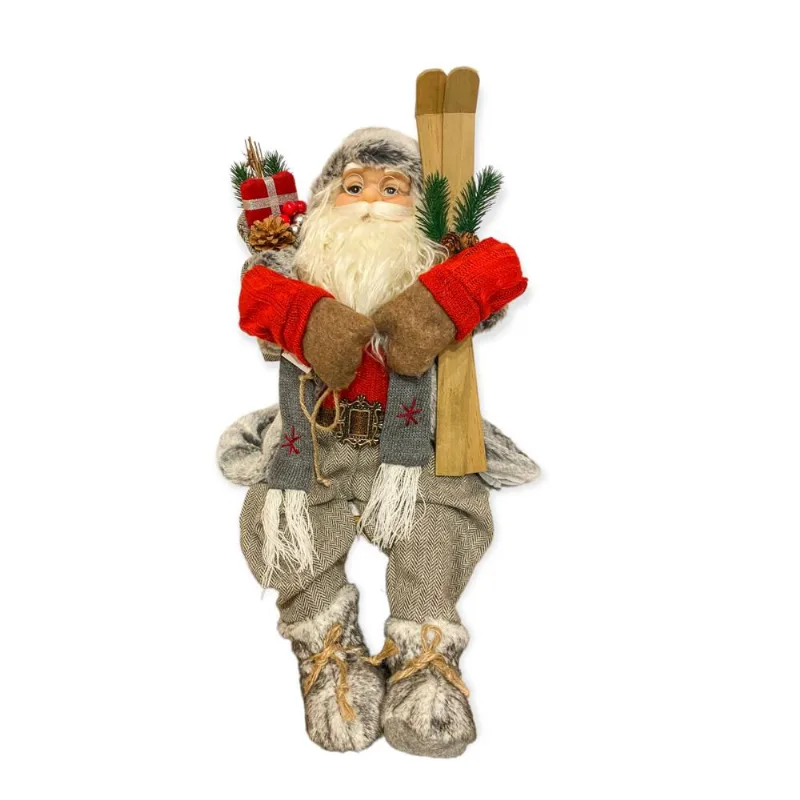Papai noel sentado com saco de presentes E ski